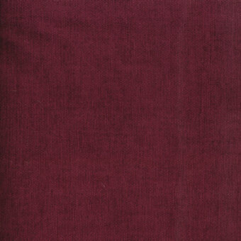 Burgundy fabric texture with a brushed weave, displaying Turri branding “754 o” and consistent color, illuminated by diffused light.